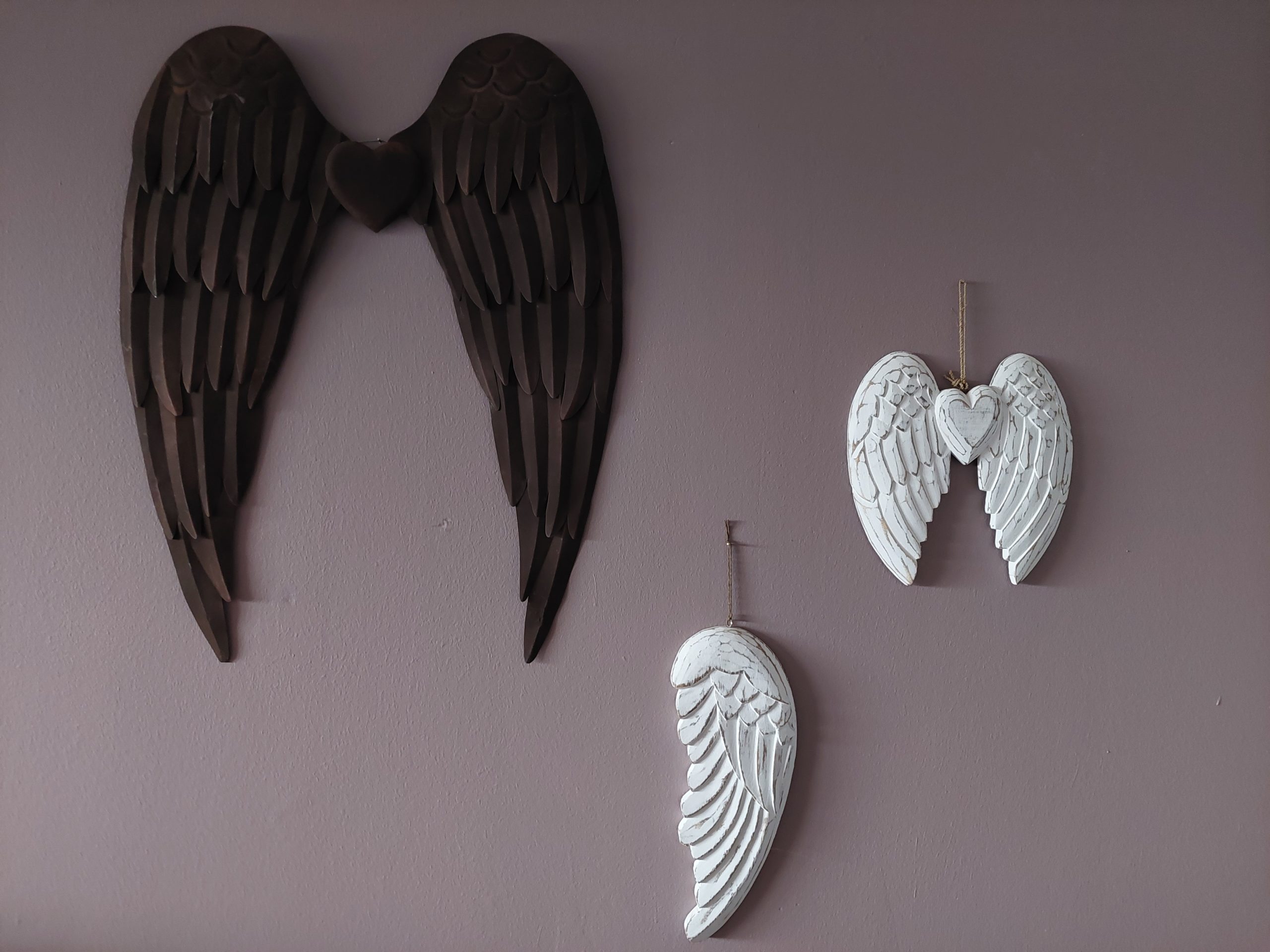 This is a picture of beautiful ceramic angel wing wall hangings at Libra Light Holistic Therapies Falkirk